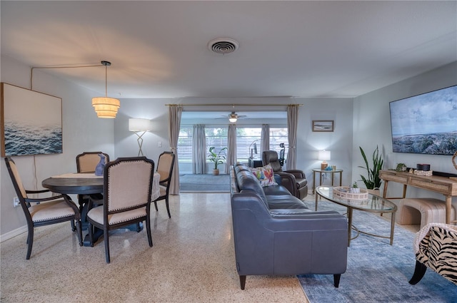 interior space with ceiling fan