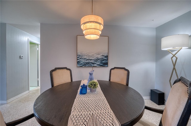 dining area featuring carpet flooring