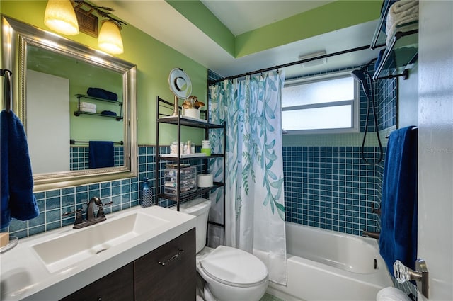 full bathroom with shower / tub combo with curtain, vanity, tile walls, toilet, and backsplash