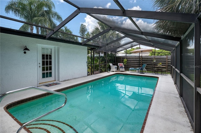 view of pool featuring a patio area and a lanai