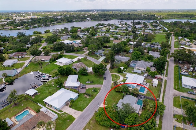 birds eye view of property with a water view