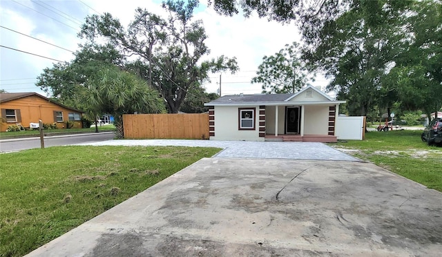 ranch-style home with a front lawn