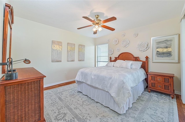 bedroom featuring ceiling fan and light hardwood / wood-style floors