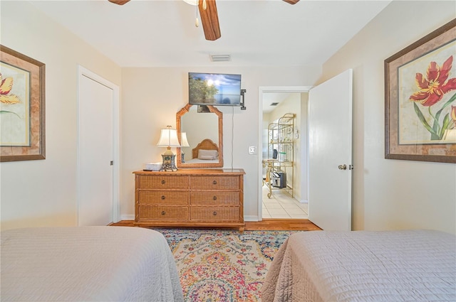 bedroom featuring ceiling fan and light hardwood / wood-style floors