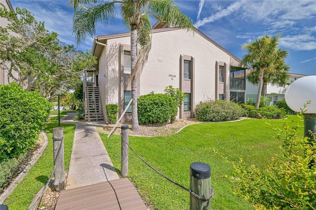 view of front of property with a front lawn