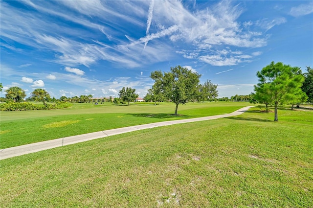 view of property's community with a lawn