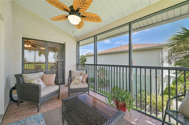 sunroom / solarium featuring vaulted ceiling and ceiling fan