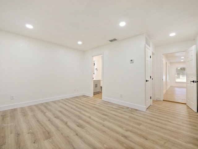 empty room with light hardwood / wood-style floors