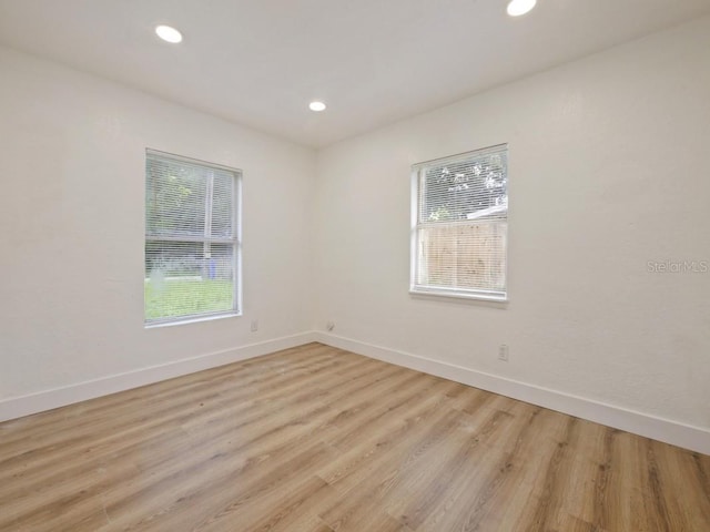 unfurnished room featuring light hardwood / wood-style flooring