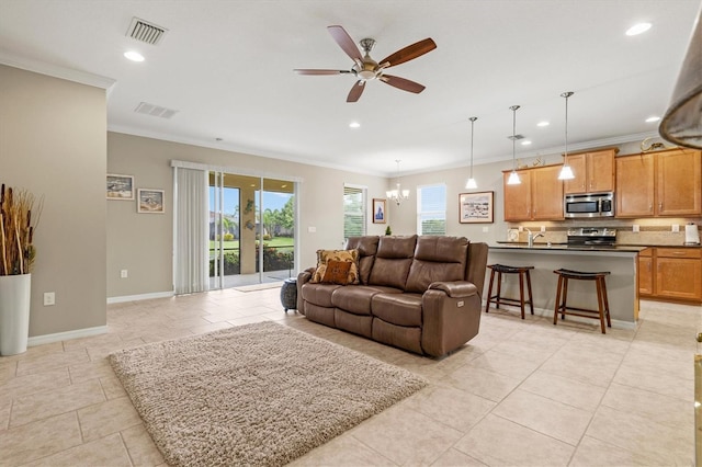 living room featuring recessed lighting, visible vents, baseboards, and ornamental molding