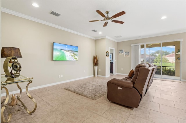 living room with ornamental molding, visible vents, and baseboards