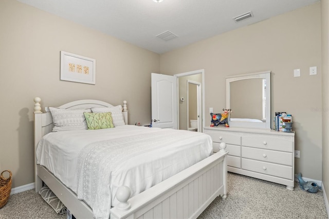 bedroom with light carpet, visible vents, and baseboards