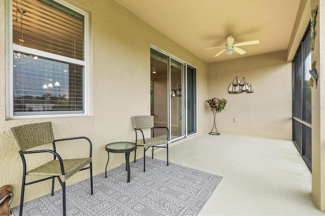 sunroom / solarium with ceiling fan