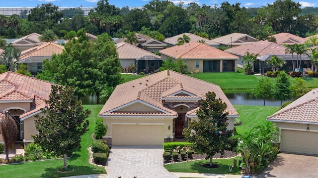 bird's eye view featuring a water view and a residential view