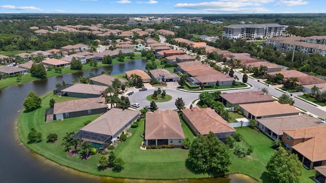 bird's eye view featuring a water view and a residential view