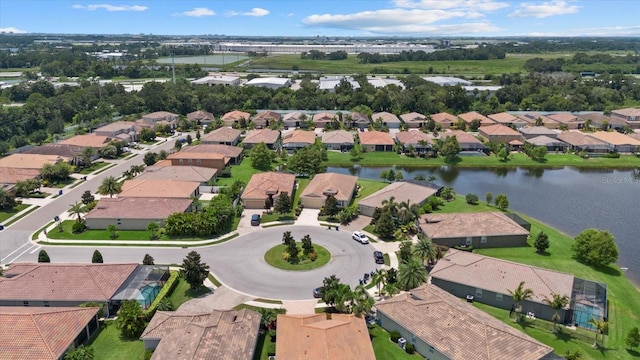 bird's eye view with a water view and a residential view