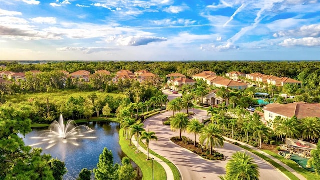 bird's eye view featuring a residential view and a water view