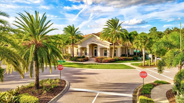 view of property's community with a lawn