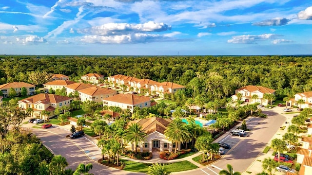 aerial view with a residential view and a wooded view