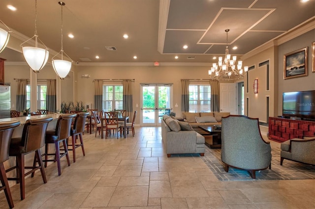 living room featuring ornamental molding, recessed lighting, stone tile flooring, and visible vents