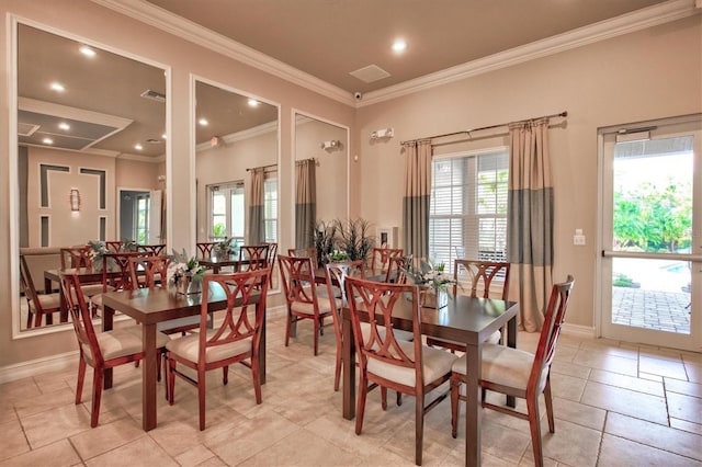 dining room featuring baseboards, recessed lighting, and crown molding