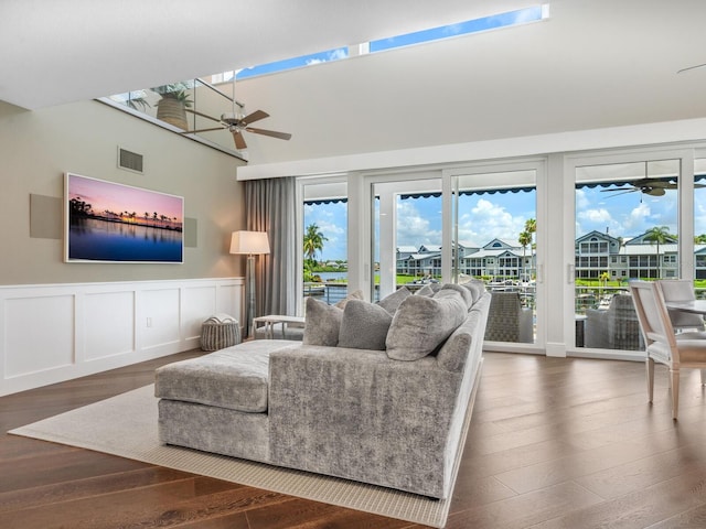 living room featuring wood-type flooring and ceiling fan