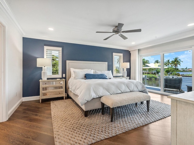 bedroom featuring ornamental molding, access to exterior, and multiple windows