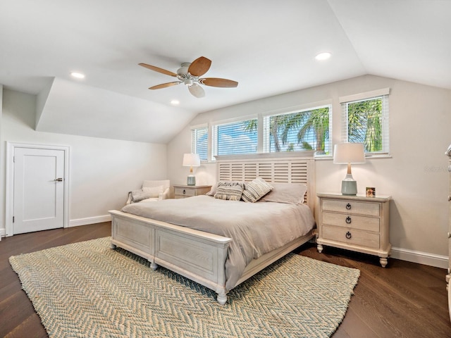 bedroom with dark hardwood / wood-style flooring, vaulted ceiling, and ceiling fan