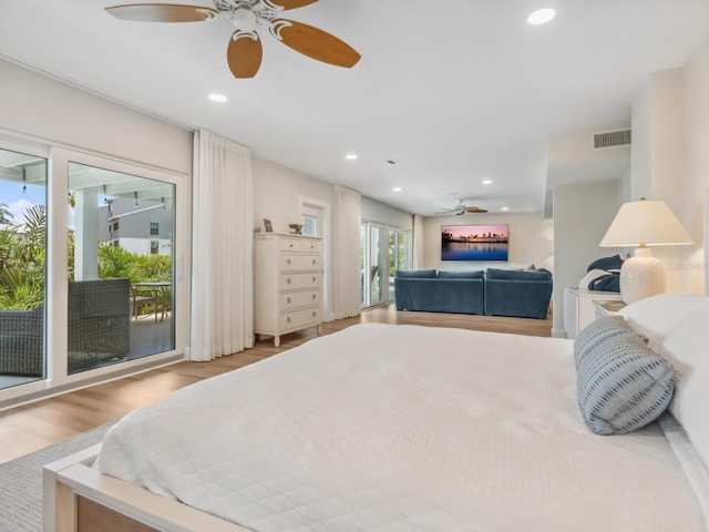 bedroom featuring light hardwood / wood-style flooring, access to outside, and ceiling fan