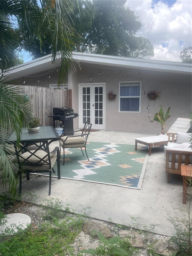 view of patio featuring french doors and a grill