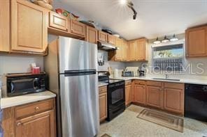 kitchen featuring sink and black appliances