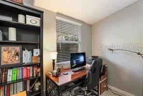 office with lofted ceiling