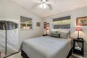 bedroom featuring ceiling fan and lofted ceiling