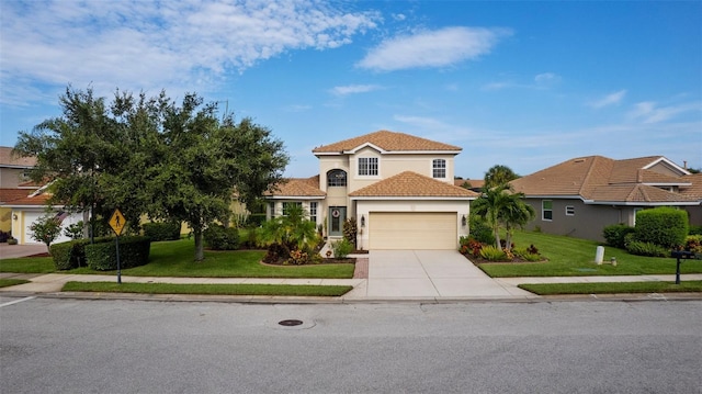 mediterranean / spanish-style home featuring a garage and a front lawn