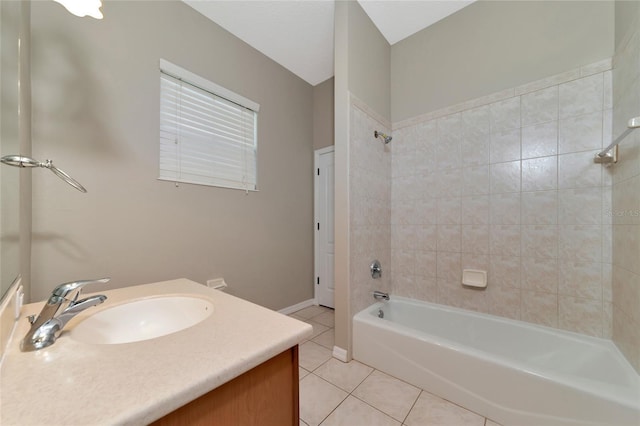 bathroom featuring tiled shower / bath combo, vanity, and tile patterned floors