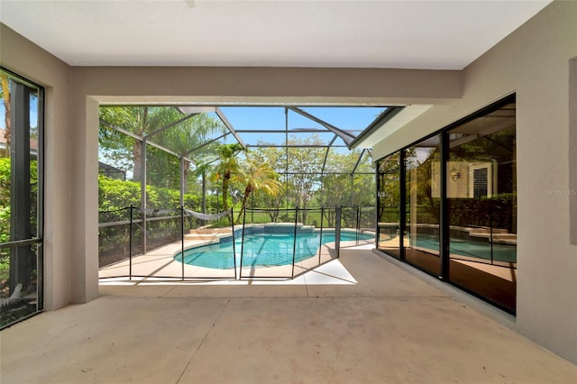 view of pool featuring a patio area and a lanai