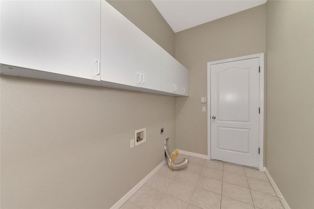 laundry room with cabinets, light tile patterned floors, electric dryer hookup, and hookup for a washing machine