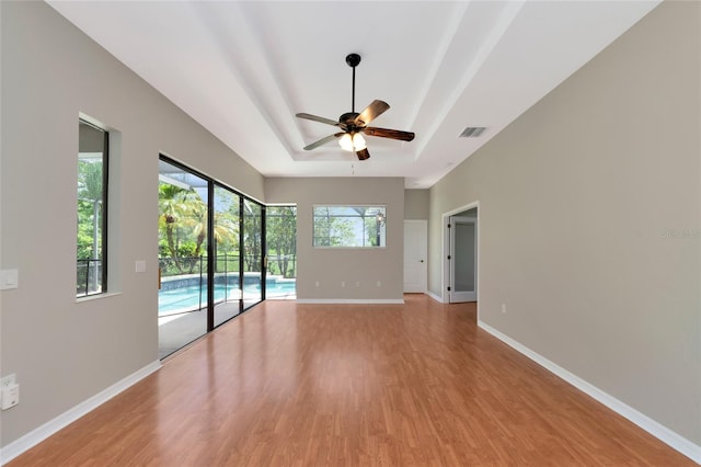 spare room featuring light hardwood / wood-style floors and ceiling fan