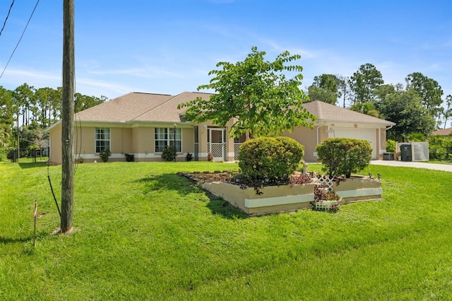 view of front of property with a garage and a front lawn