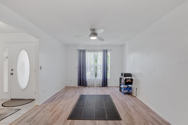 entryway with ceiling fan and light hardwood / wood-style flooring