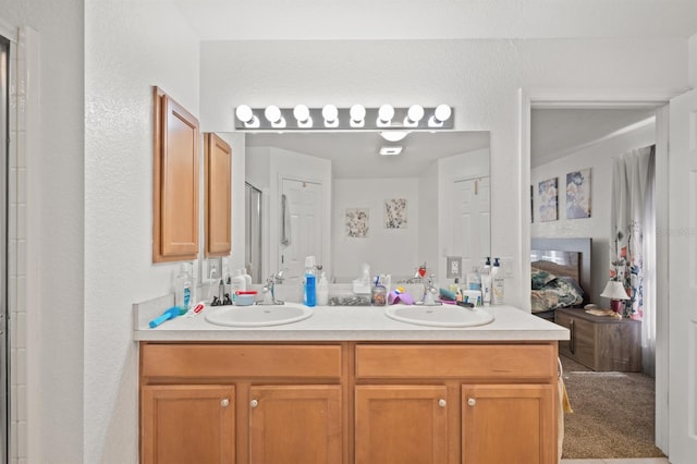 bathroom featuring dual vanity