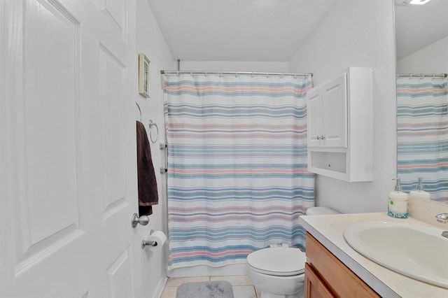 bathroom with tile patterned floors, vanity, and toilet