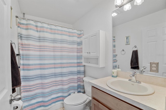 bathroom with toilet and vanity