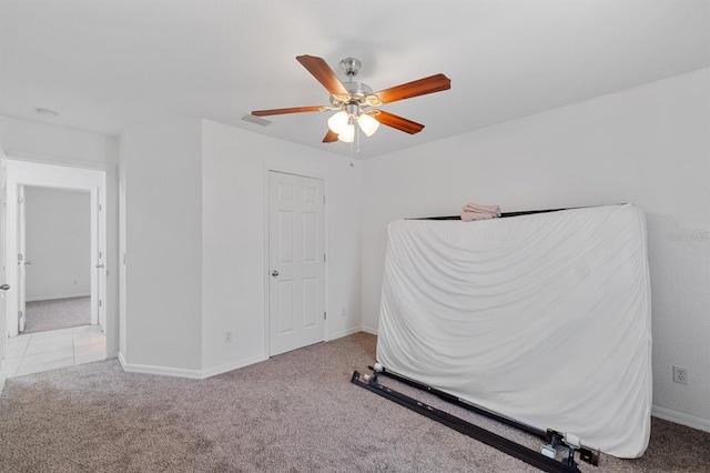 unfurnished bedroom with light carpet and ceiling fan