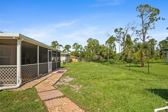 view of yard with a sunroom