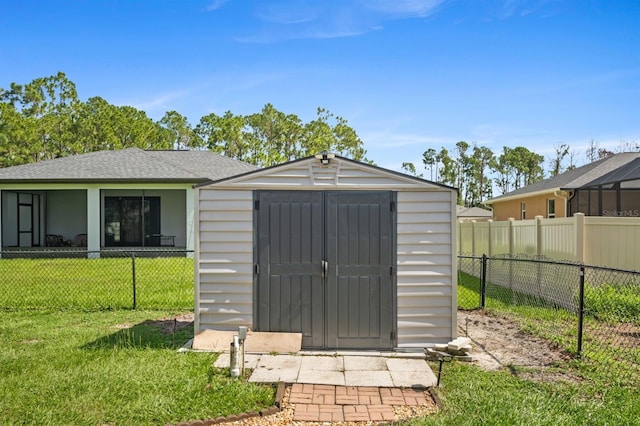 view of outdoor structure with a yard