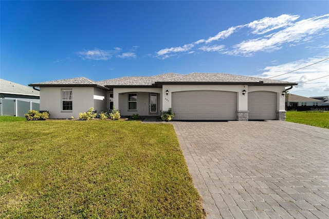 view of front facade with a garage and a front yard