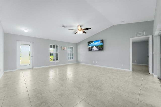 unfurnished living room with ceiling fan, lofted ceiling, and light tile patterned floors