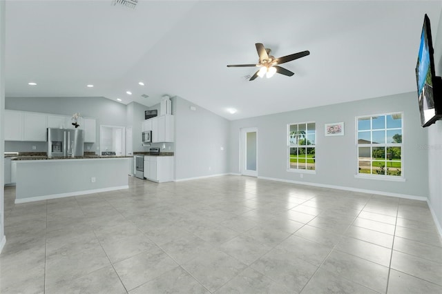 unfurnished living room with high vaulted ceiling, ceiling fan, and light tile patterned floors