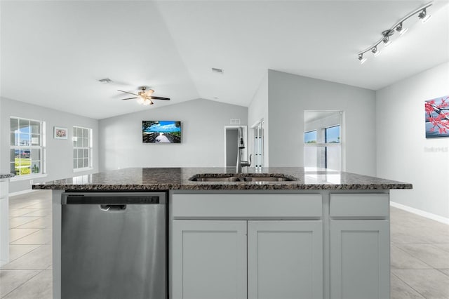 kitchen featuring stainless steel dishwasher, light tile patterned flooring, ceiling fan, sink, and track lighting